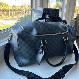 Men’s LV luggage bag. Never been used.  Was a gift and he never used it.